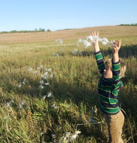 kid playing at prairie woods in the outdoors